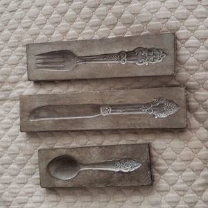 Replica period pieces of Victorian silverware...wall decor.